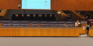 Paper Presentation Conference hall, researcher presenting work